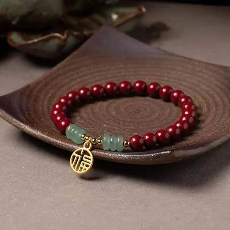 Traditional handmade gold cinnabar wave bracelet with copper bead accents in pumpkin or brand cinnabar colour options