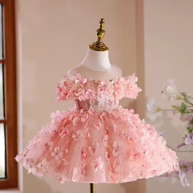 Girls pink polyester pettiskirt princess style dress on white background showing full skirt shape