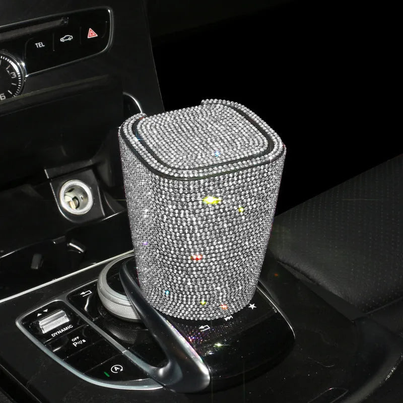 Diamond-embedded car ashtray with lid, air outlet hanging design, plastic cast body, available in nine colours.