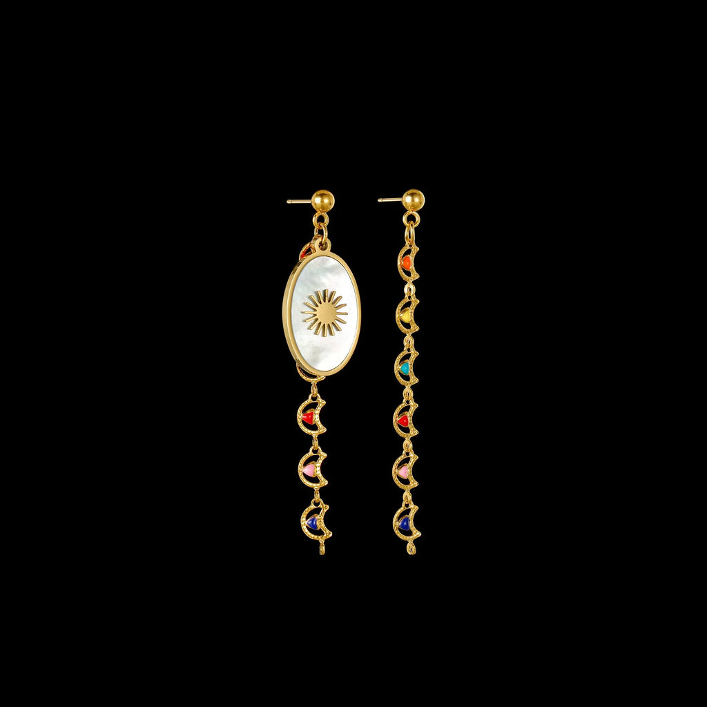 Geometric stainless steel drop earrings showing Eight Awn Star, Eye, and Shell Sun designs on a white background.