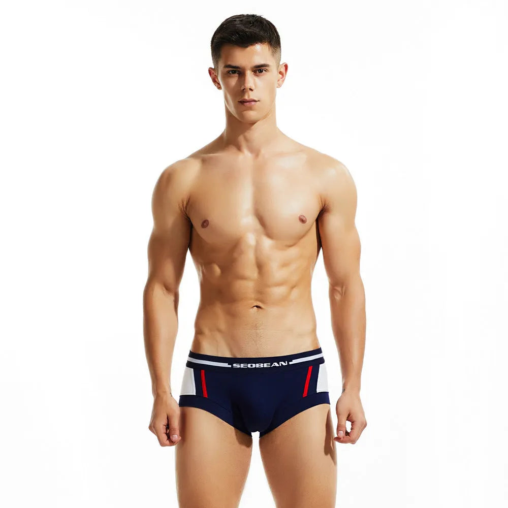 Men's cotton boxer shorts in dark blue, light grey and red colours showing low waist design