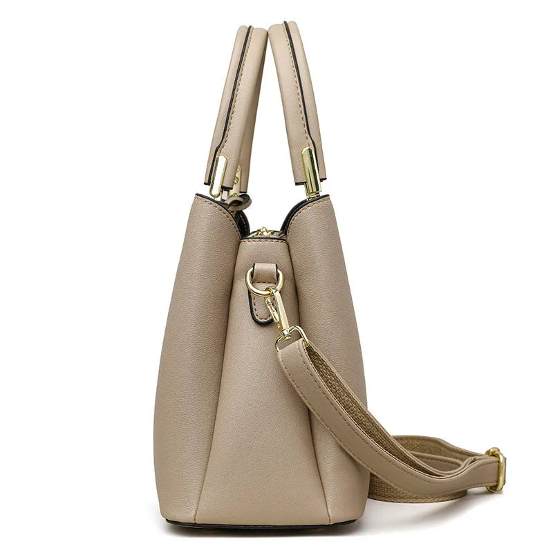 Women's black PU messenger bag with multi-layer shoulder strap and sewing thread detailing