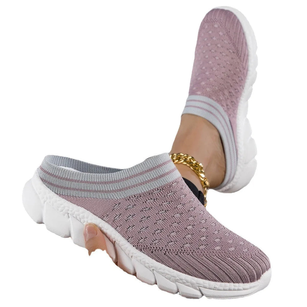 Women's black Flyknit semi-slipper shoe with striped pattern and raised sole