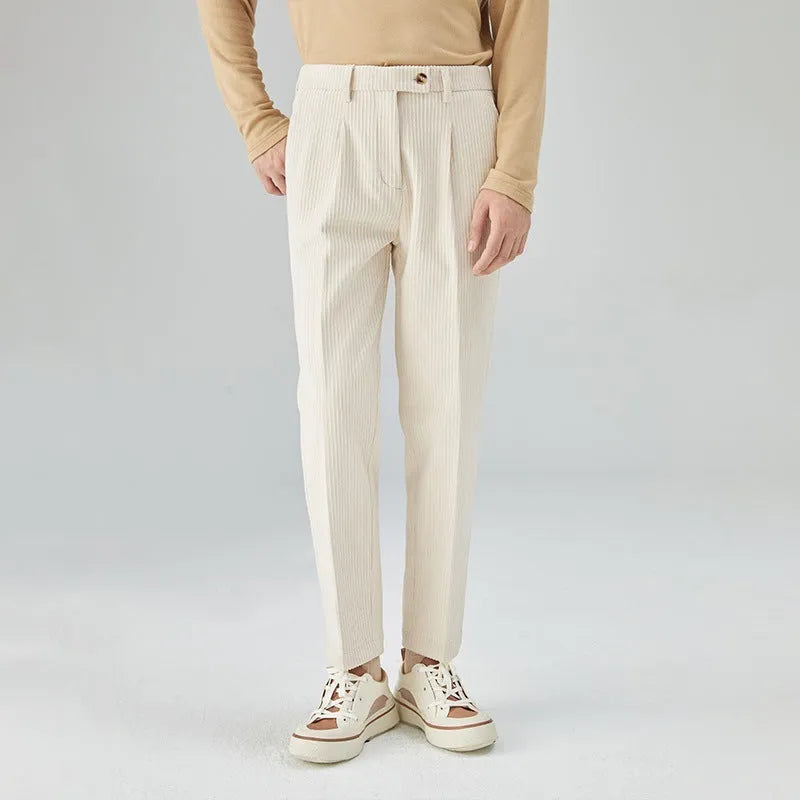 Men's beige corduroy straight leg loose fit trousers with a mid-rise elastic waistband.