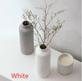 Ceramic vase in European style, grey colour, 22.7cm tall on a shelf
