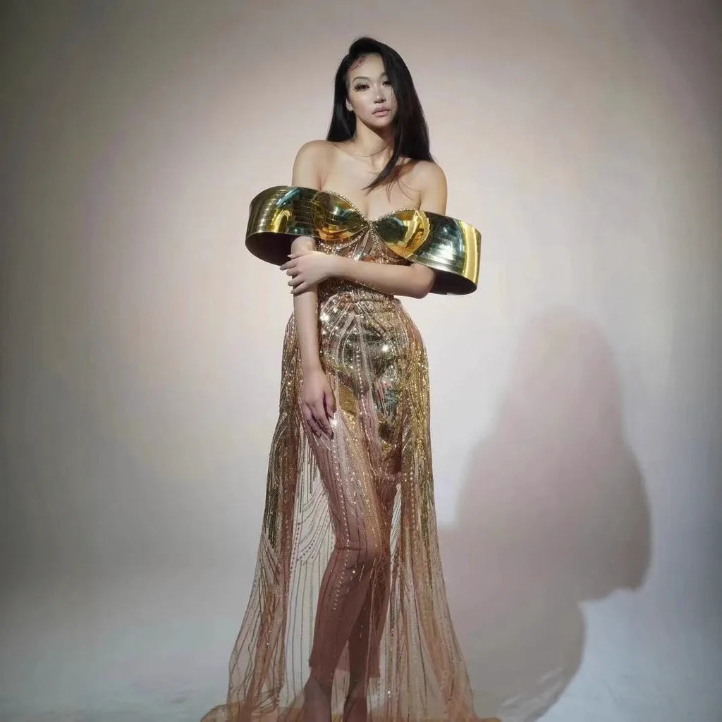 Gold strapless sequined evening dress with a long tulle skirt and a high side split.
