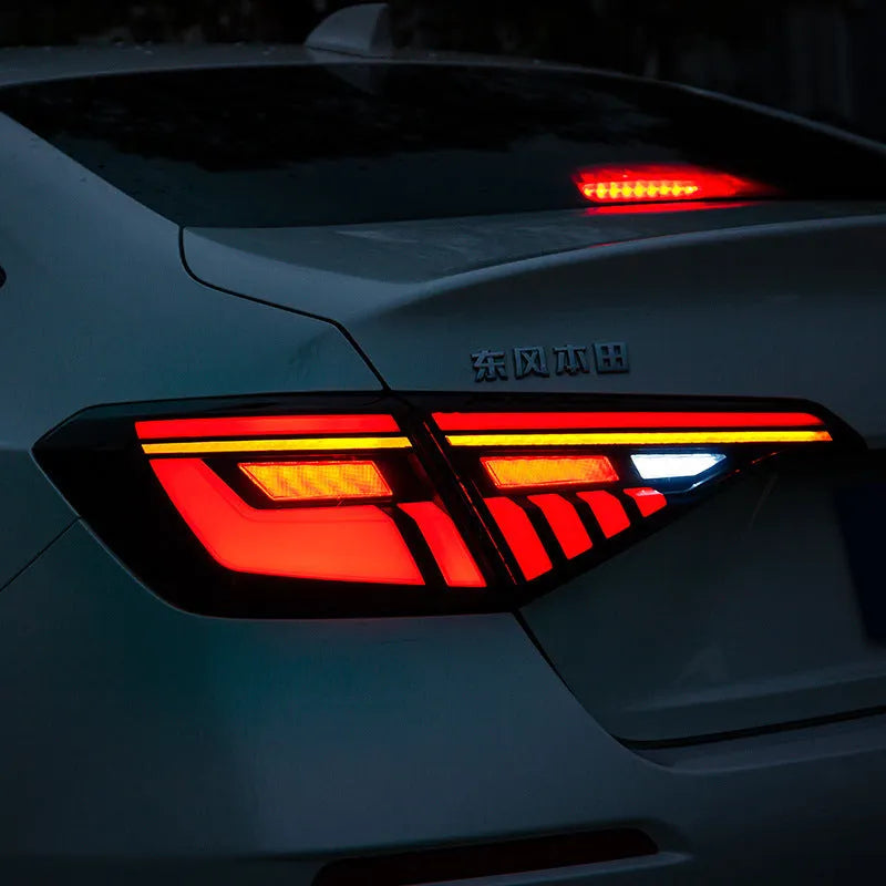 11th generation Honda Civic black and red LED tail light assembly with sequential indicators
