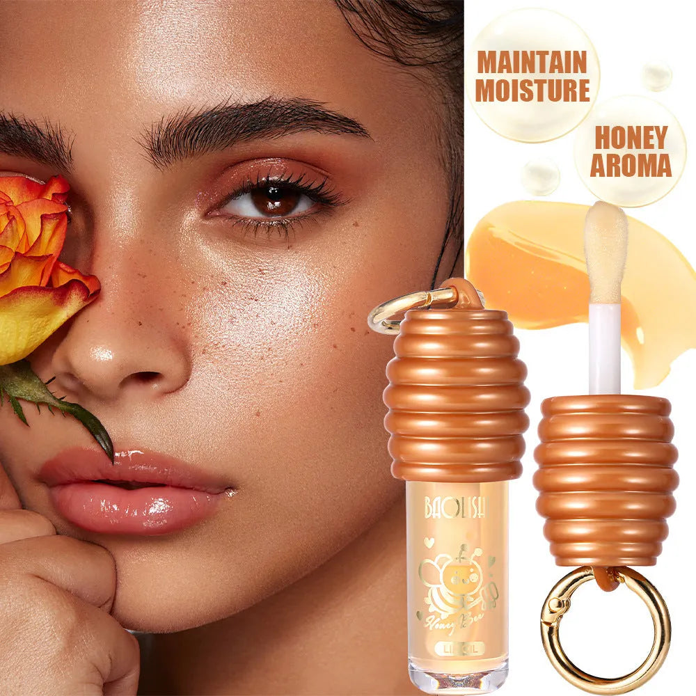 Honey coloured lip gloss with keychain attachment for bags