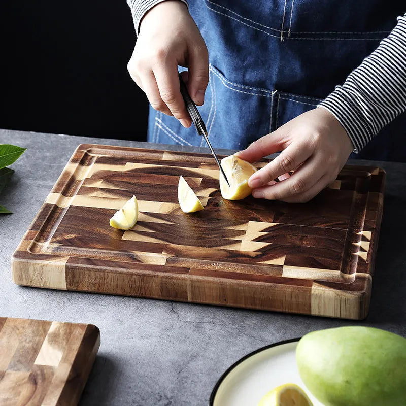 Brown acacia solid wood chopping board with parquet design, 3cm thick, on a kitchen counter