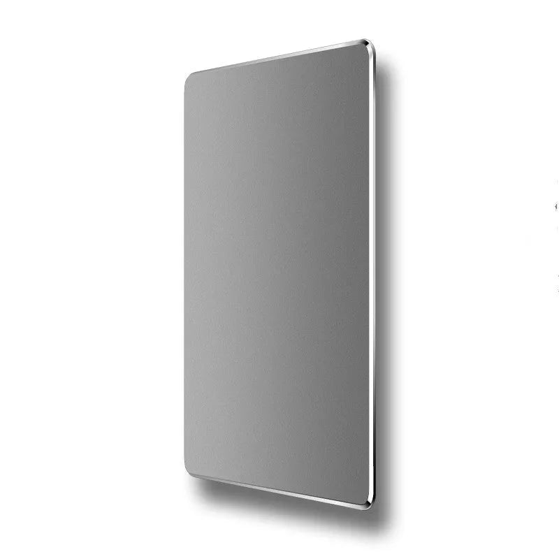 Double-sided aluminium non-slip mouse pad in black with smooth and textured surfaces on a desk