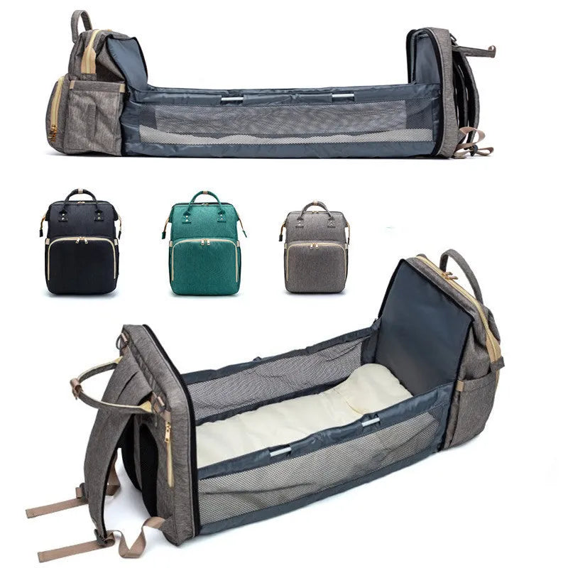 Folding baby bag bed backpack with portable mattress, USB charging option, front pocket, and multiple colour choices
