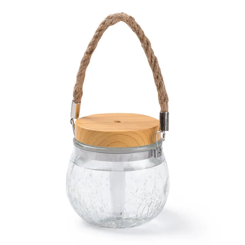 Round desktop USB humidifier in white plastic and glass with heavy fog output