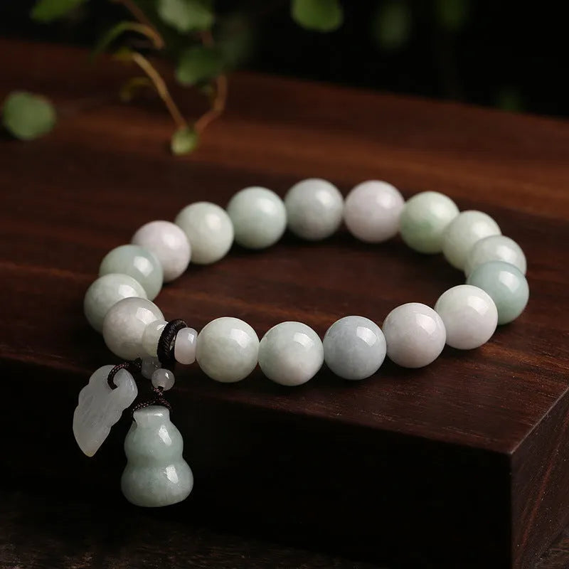 Natural emerald jade bracelet with geometric pendant and Maitreya Buddha charm