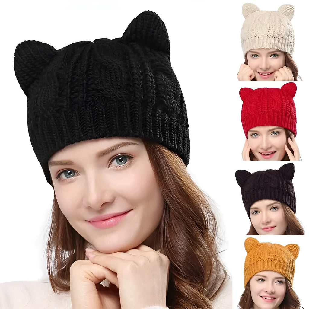 Hand-made red knitted beanie with 3D cat ears on a white background