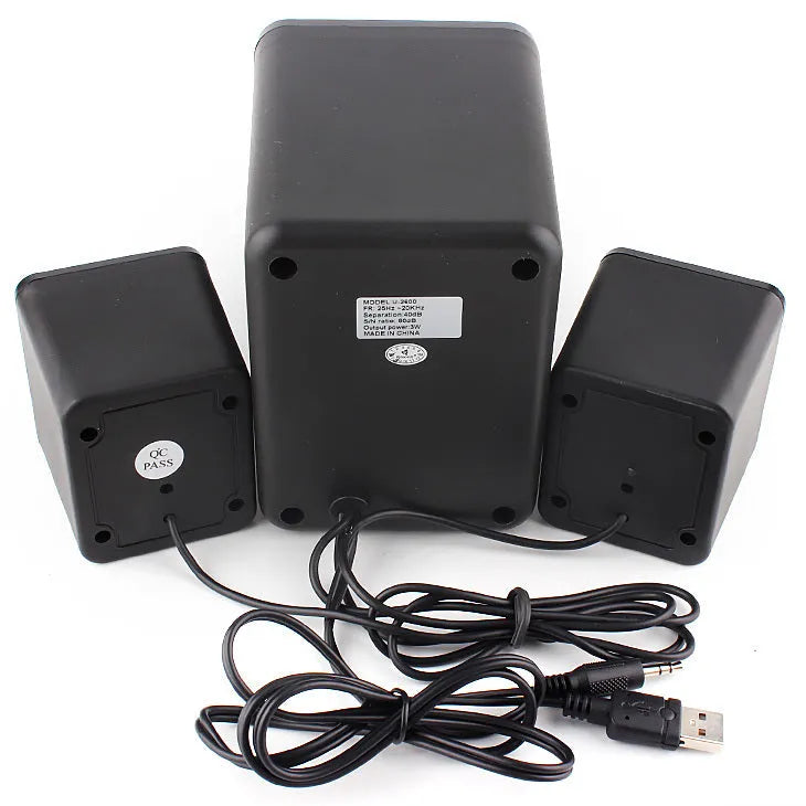 Green USB computer speaker with colourful glow lights showing 2.1 channel audio ports