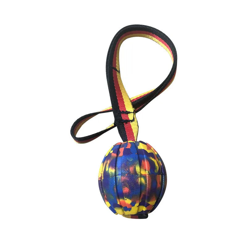 Floating EVA dog training ball with attached string in camouflage or yellow colour options