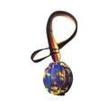 Floating EVA dog training ball with attached string in camouflage or yellow colour options