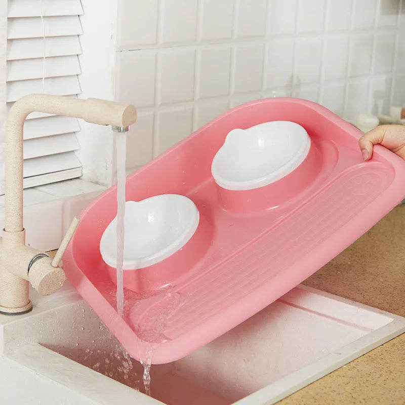 Double plastic pet bowl in grey, blue, green, or pink, measuring 45x35x8cm with anti-skid base.