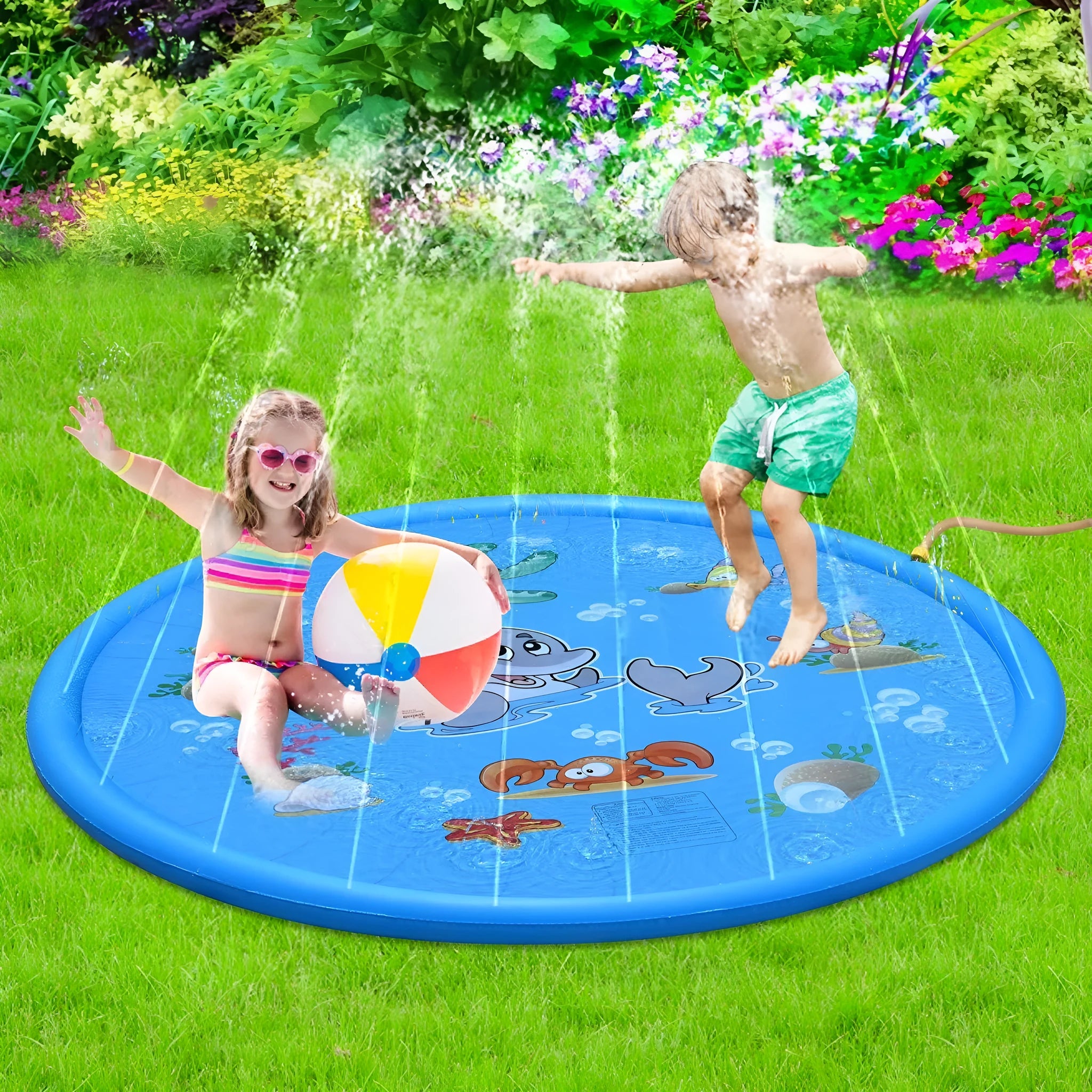 Blue PVC children's water spray pool mat with marine animal designs laid out on grass