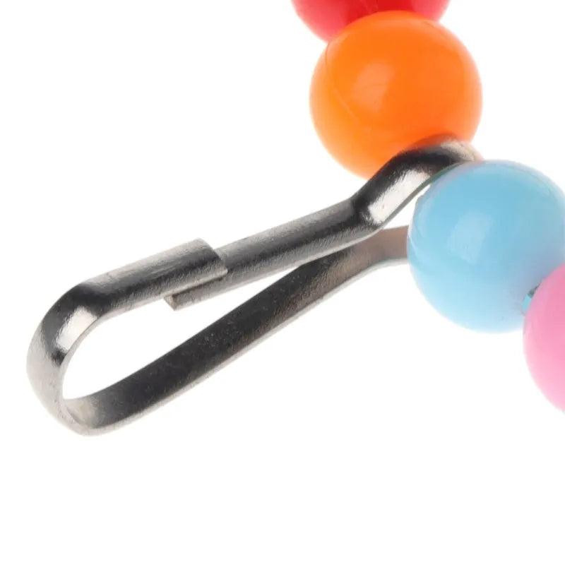Wooden parrot swing with colourful beads, two bells, and a hanging hook, 10cm by 1.4cm by 15cm
