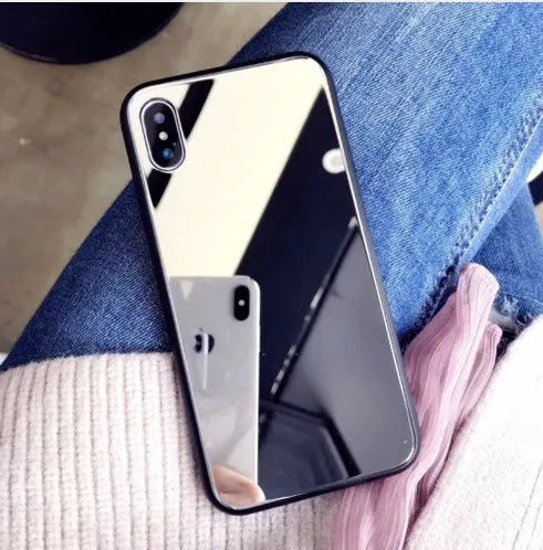 Black iPhone mirror case showing reflective surface on back, compatible with multiple iPhone models