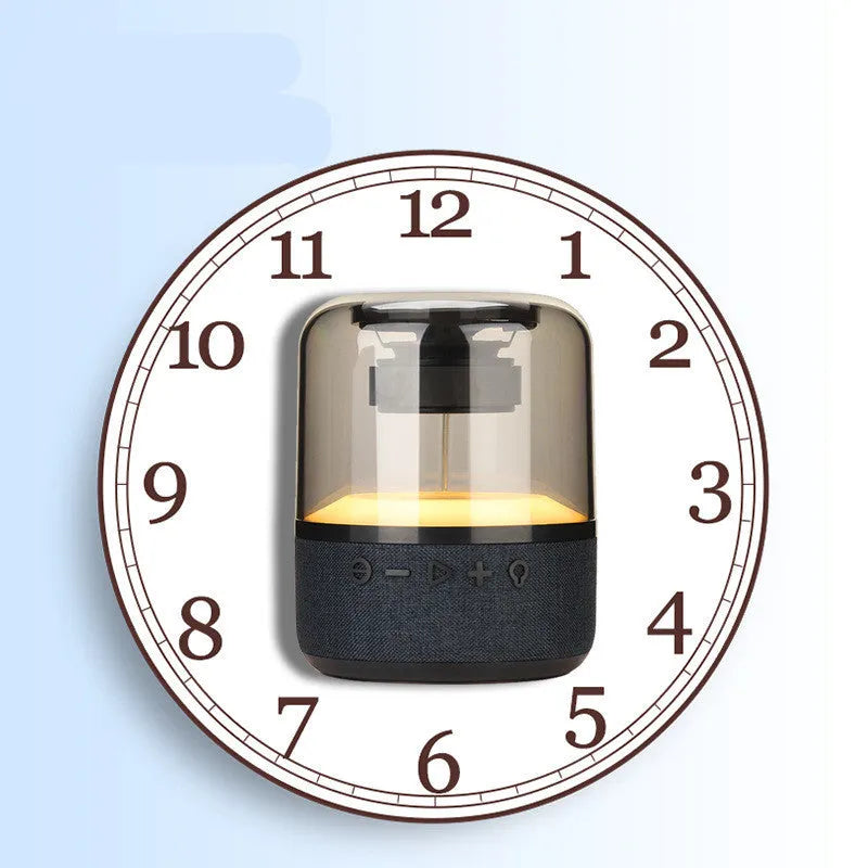 Four-colour light touch wireless Bluetooth speaker with halo lighting effect on a table.