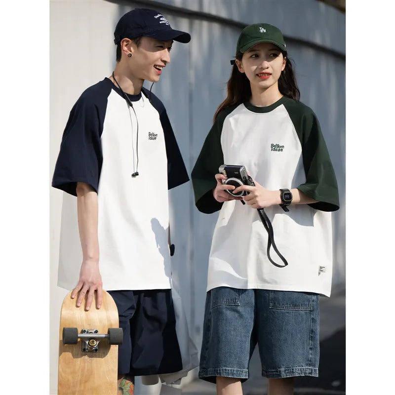 Blue casual men's t-shirt with raglan sleeves on a hanger, showing loose fit.