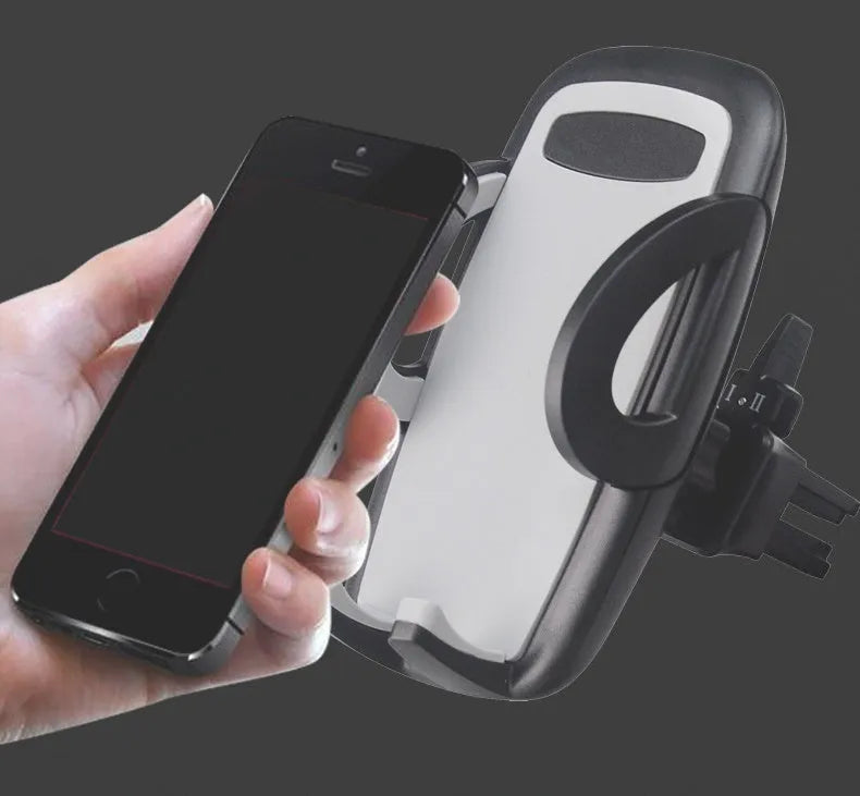 Universal black plastic car air vent mobile phone holder mounted on a car dashboard.
