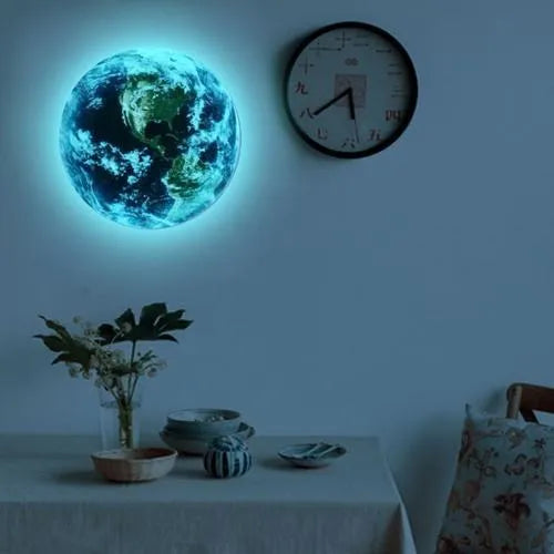 Glow in the dark 3D planet Earth wall sticker on a dark background.