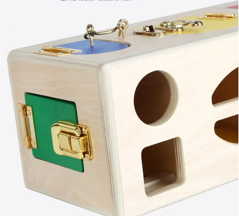 Wooden educational shape sorting lock box toy with coloured blocks for preschool children.