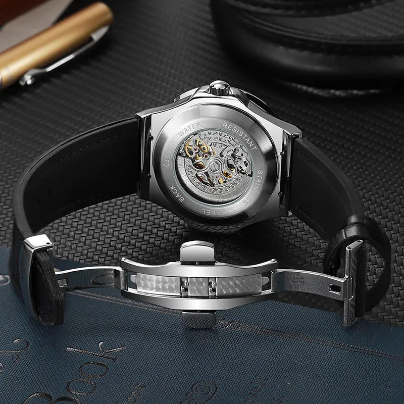 Automatic mechanical men's watch with hollow movement, diamond studs, and a 16mm thick case on a leather strap.