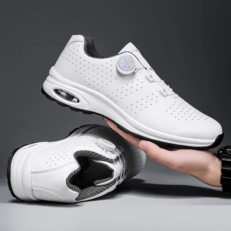 Low-top black and white mesh casual shoes with cross shoulder strap and round toe on a composite sole.