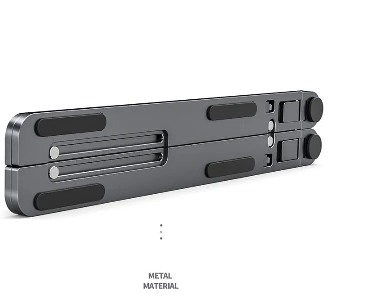 A folded deep grey aluminium laptop stand next to an open silver laptop on a desk.