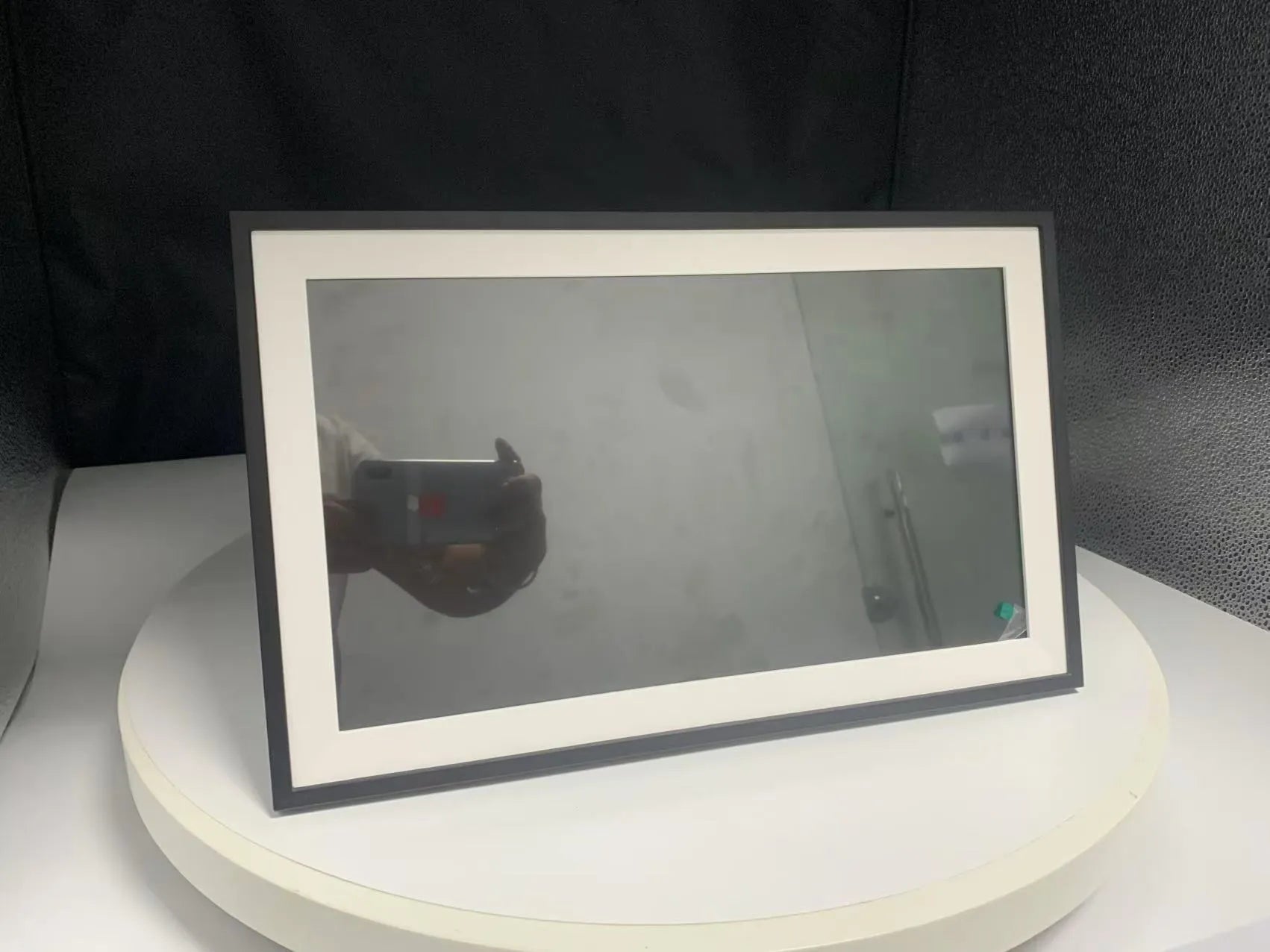 White 15.6-inch smart digital photo frame with app control on table