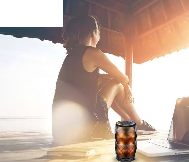 Black crystal diamond cut Coca-Cola can Bluetooth speaker lantern with colourful LED lights illuminated.