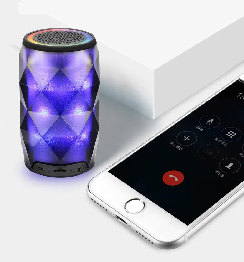 Black crystal diamond cut Coca-Cola can Bluetooth speaker lantern with colourful LED lights illuminated.