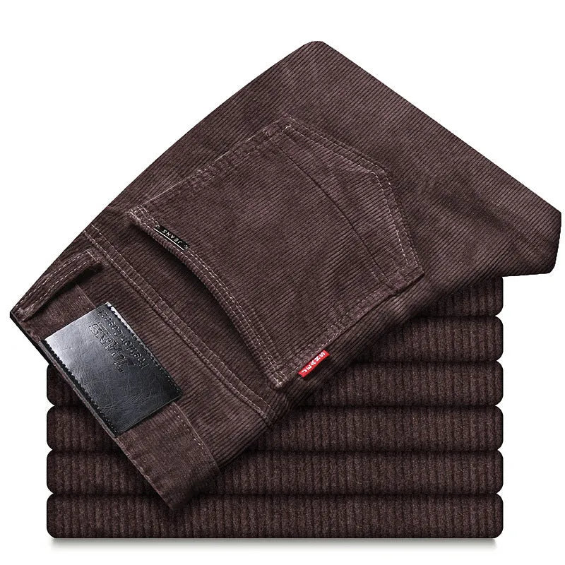 Straight slim-fit cotton corduroy trousers in black, side view, mid-waist, zip-placket fly