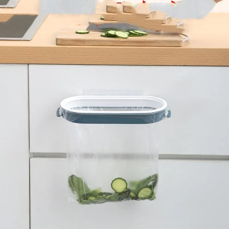 Blue plastic kitchen garbage bag storage rack on a worktop holding a roll of bin liners.