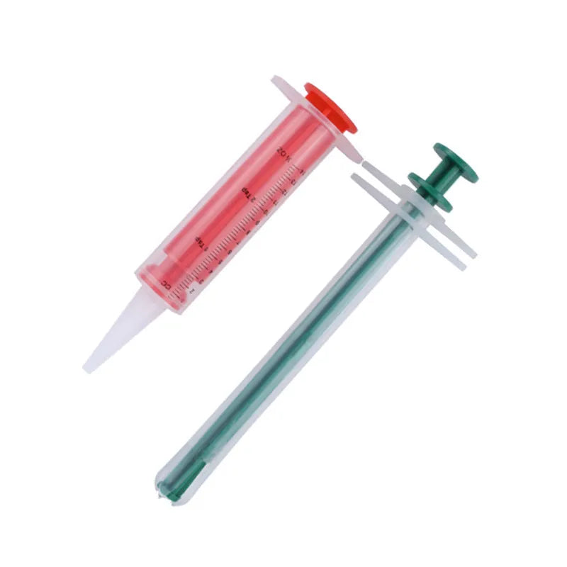 Two silicone pet pill shooter dispensers with soft tips for feeding medicine to cats and dogs