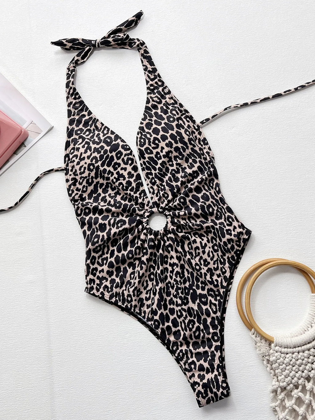 Women's leopard print one-piece swimsuit with hollow-out ring detail on front.