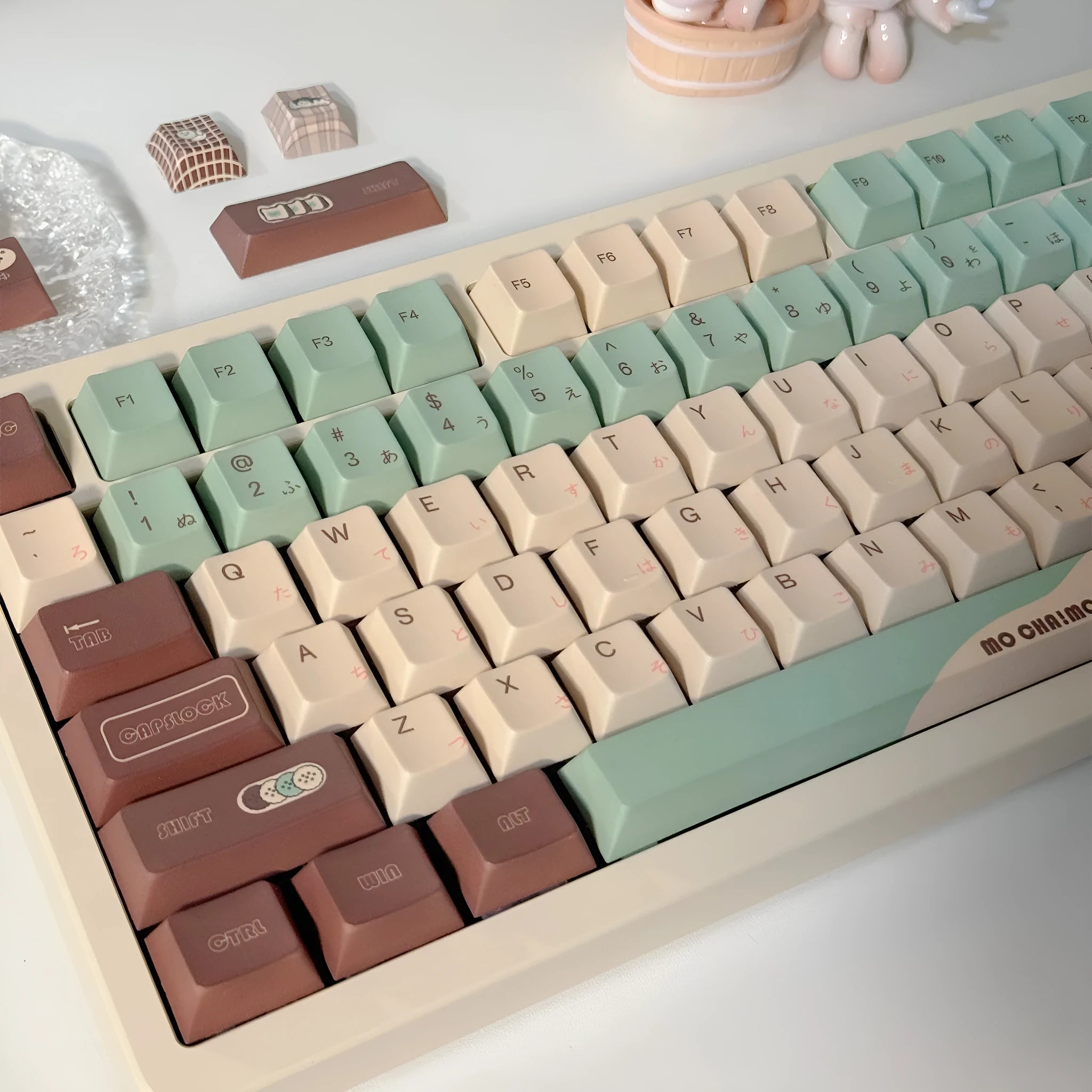Matcha green mechanical keyboard keycap set with five-sided sublimation printing and key puller tool on a white background.
