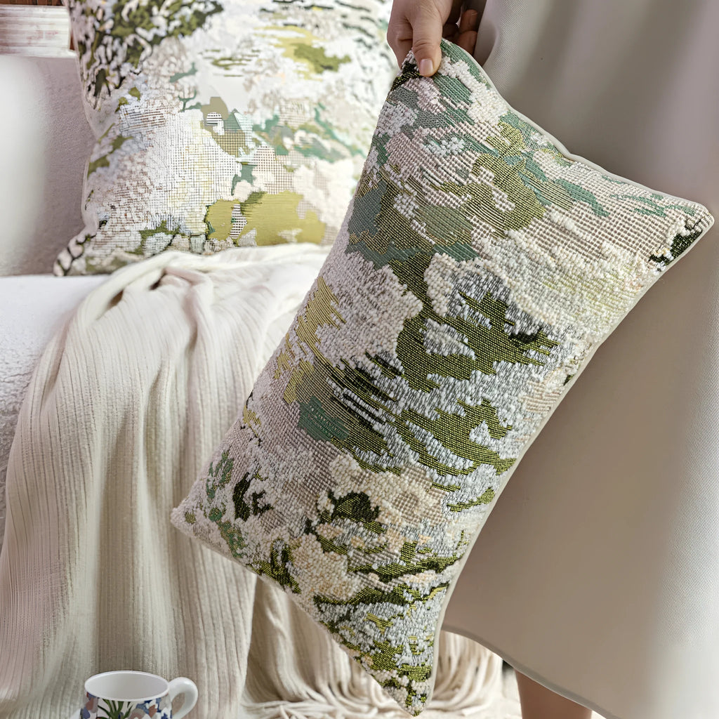 Antique green wool blend cushion cover with abstract spring flowers pattern, shown in square and lumbar sizes.