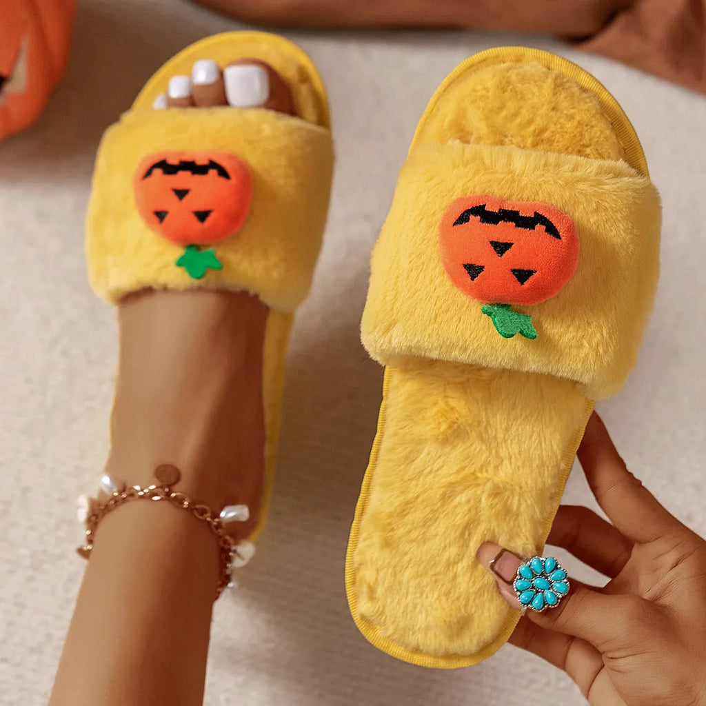 White and yellow Halloween pumpkin plush open toe slippers with synthetic fur and PVC sole.