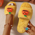 White and yellow Halloween pumpkin plush open toe slippers with synthetic fur and PVC sole.