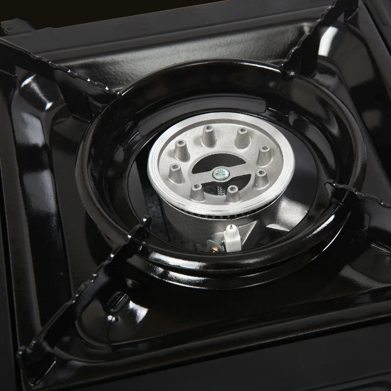 Outdoor windproof portable cassette stove in black plastic case with piezoelectric ignition and safety device
