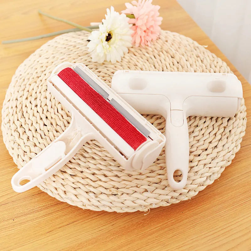 White plastic roller brush for pet hair removal on fabric surface