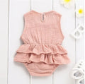 Baby girl sleeveless pettiskirt dress in cotton, shown in pink stripe, with dark buckle and no hood.