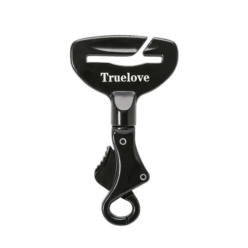 Black aluminium alloy dog car seat belt lock with 5cm tab resting on car seat