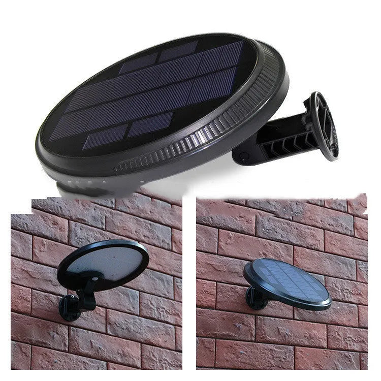 Black outdoor solar wall light with LED panel on a brick wall, IP65 waterproof garden lighting
