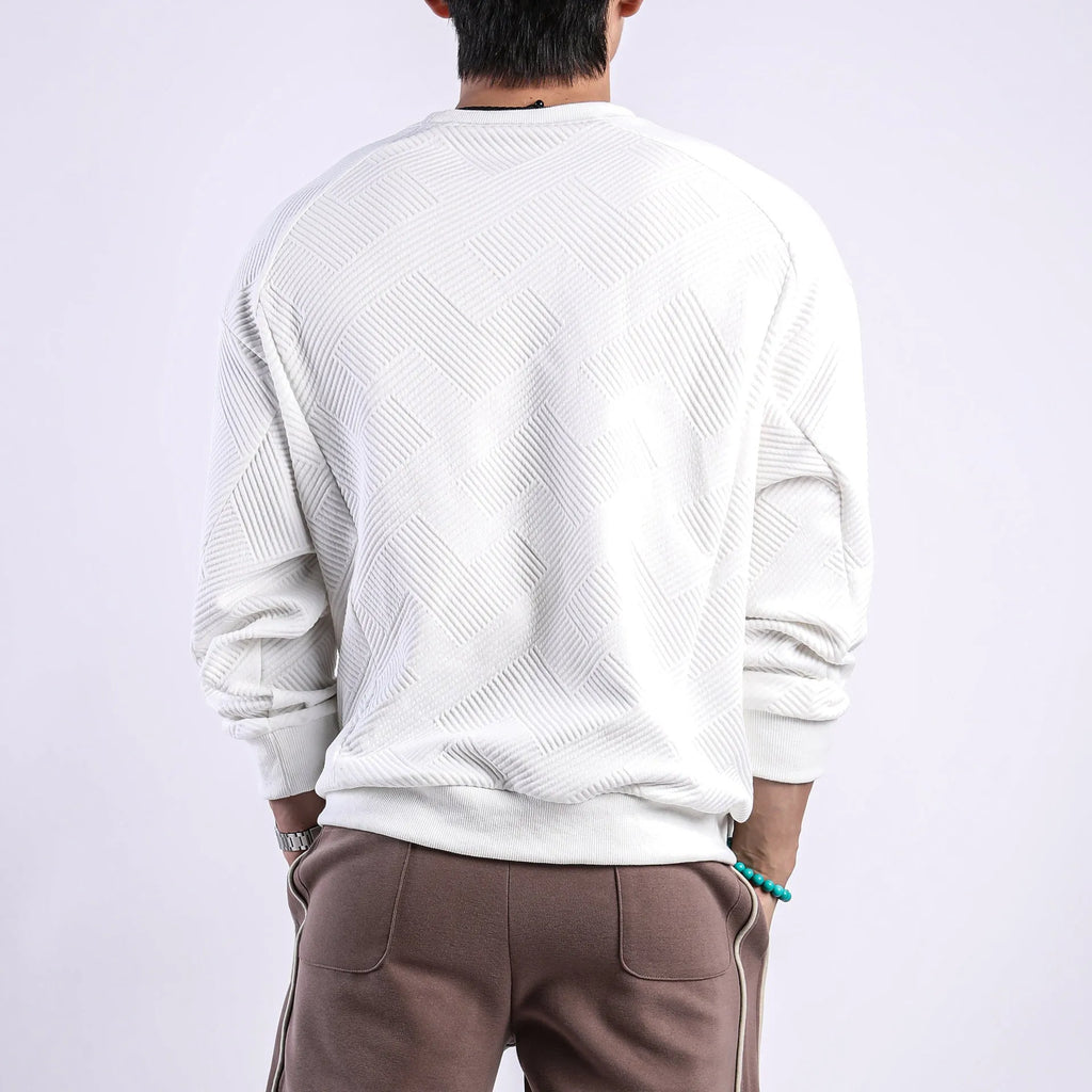 Man wearing a loose fit Army Green long sleeve twill jacquard pullover sweater.
